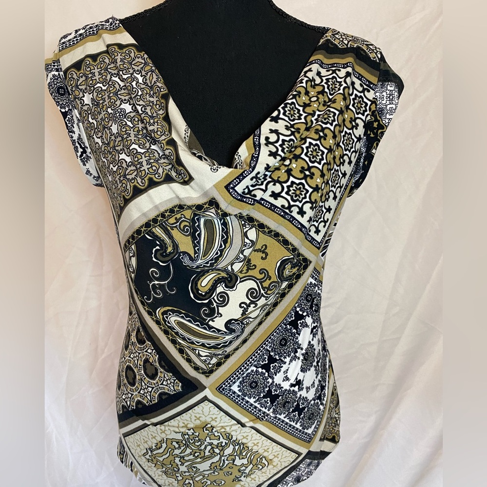 Sleeveless, cowl neck top made by Premise.